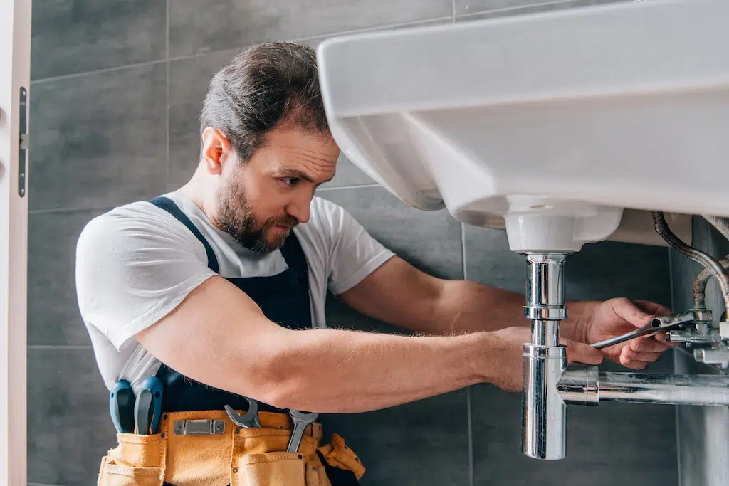 plumber in working plumbing services surrey